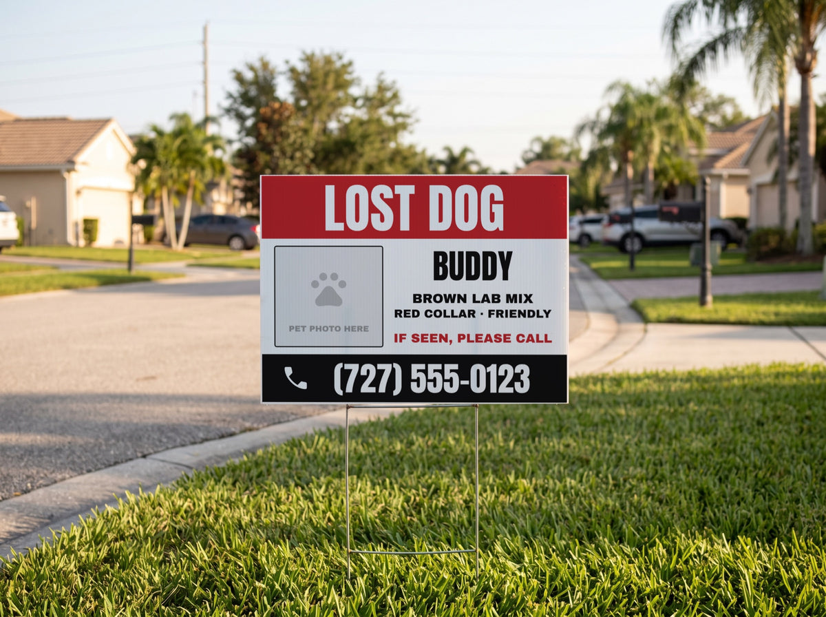 Lost dog yard sign on a lawn beside a neighborhood street